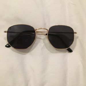 Gold framed sunglasses